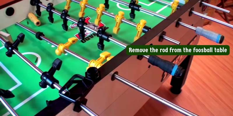 Remove the rod from the foosball table