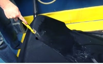 Filling basketball hoop base with water
